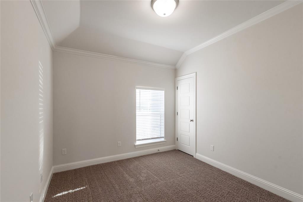 331 Prien Lk Loop Bossier City, LA 71111 - Photo 20 of 37 Carpeted empty room with crown molding and vaulted ceiling