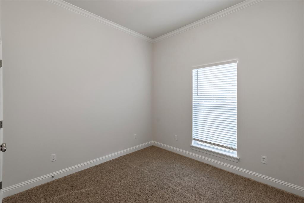 331 Prien Lk Loop Bossier City, LA 71111 - Photo 22 of 37 Carpeted empty room with ornamental molding and baseboards