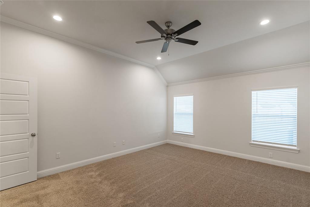 331 Prien Lk Loop Bossier City, LA 71111 - Photo 25 of 37 Unfurnished room with healthy amount of natural light, ornamental molding, carpet floors, recessed lighting, and lofted ceiling