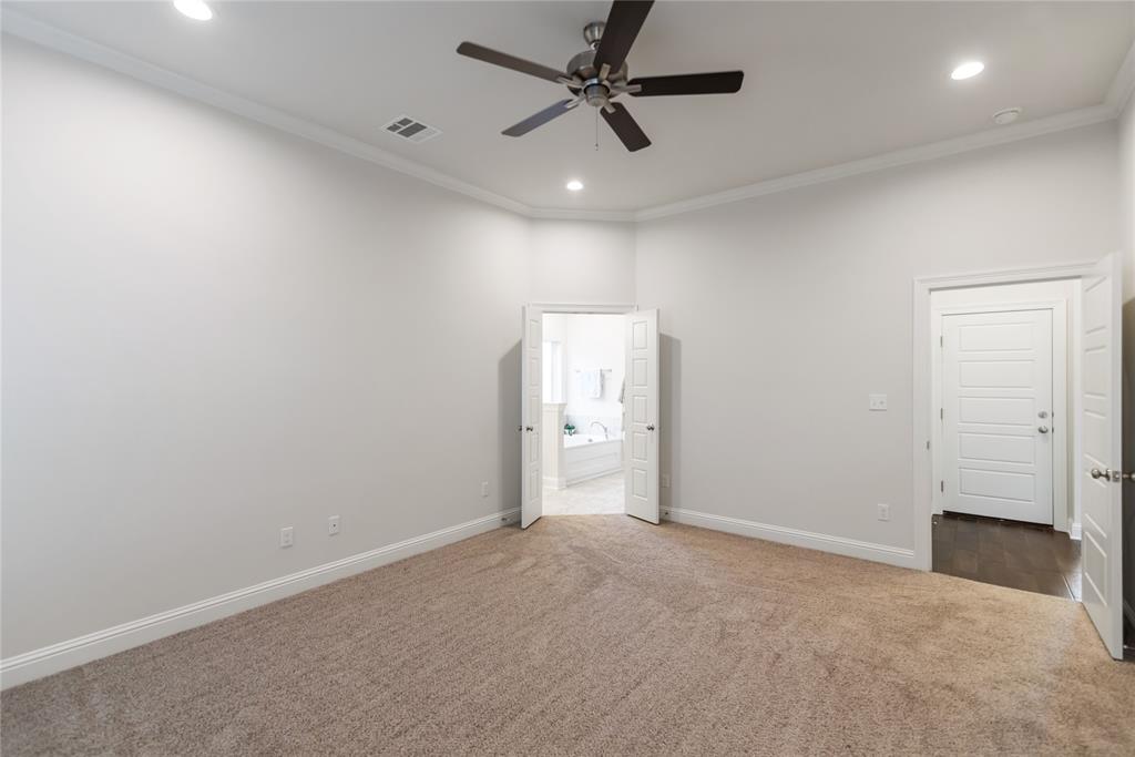 331 Prien Lk Loop Bossier City, LA 71111 - Photo 26 of 37 Unfurnished bedroom with dark colored carpet, crown molding, ensuite bathroom, recessed lighting, and a ceiling fan