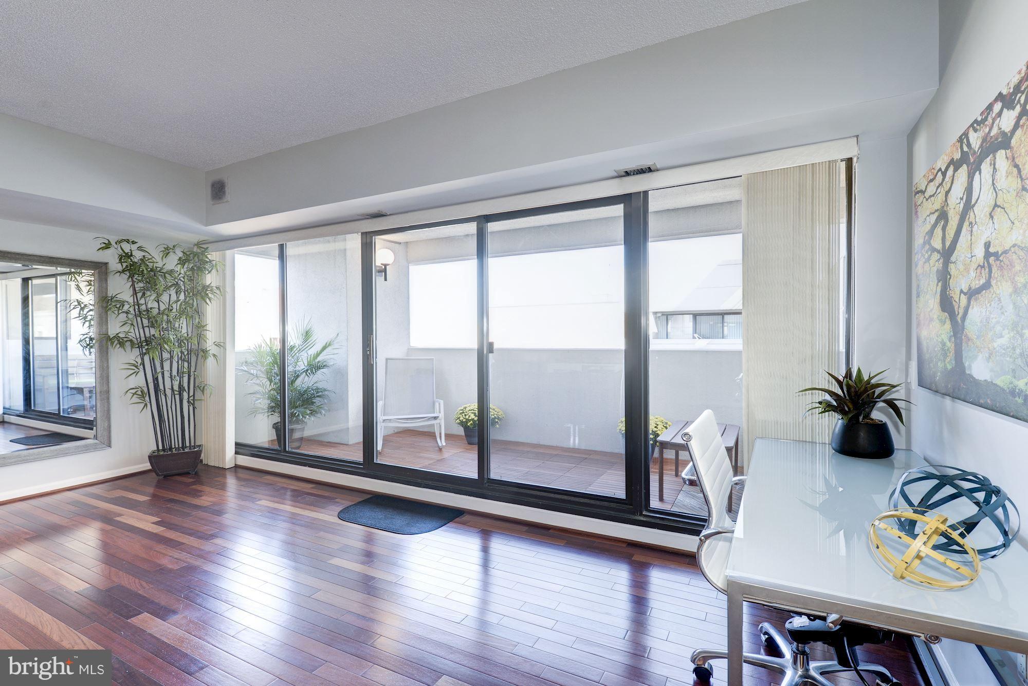 2311 M Street Northwest, Unit 1002 Washington, DC 20037 - Photo 12 of 29 Large Wall Of Glass Windows To Balcony