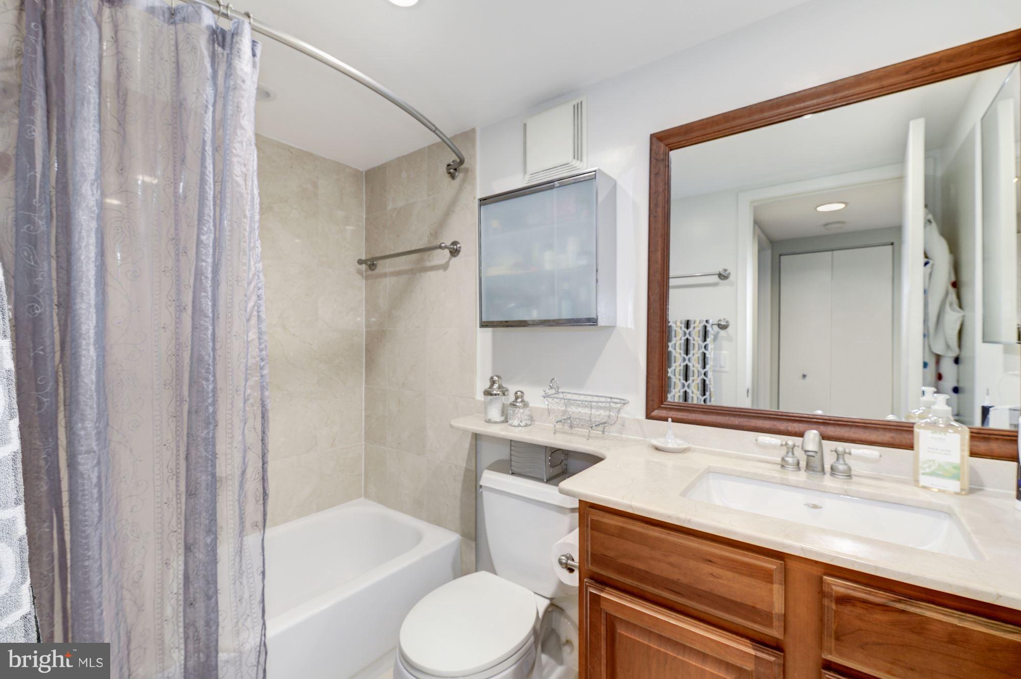 2311 M Street Northwest, Unit 1002 Washington, DC 20037 - Photo 18 of 29 Bathroom With Tan Marble