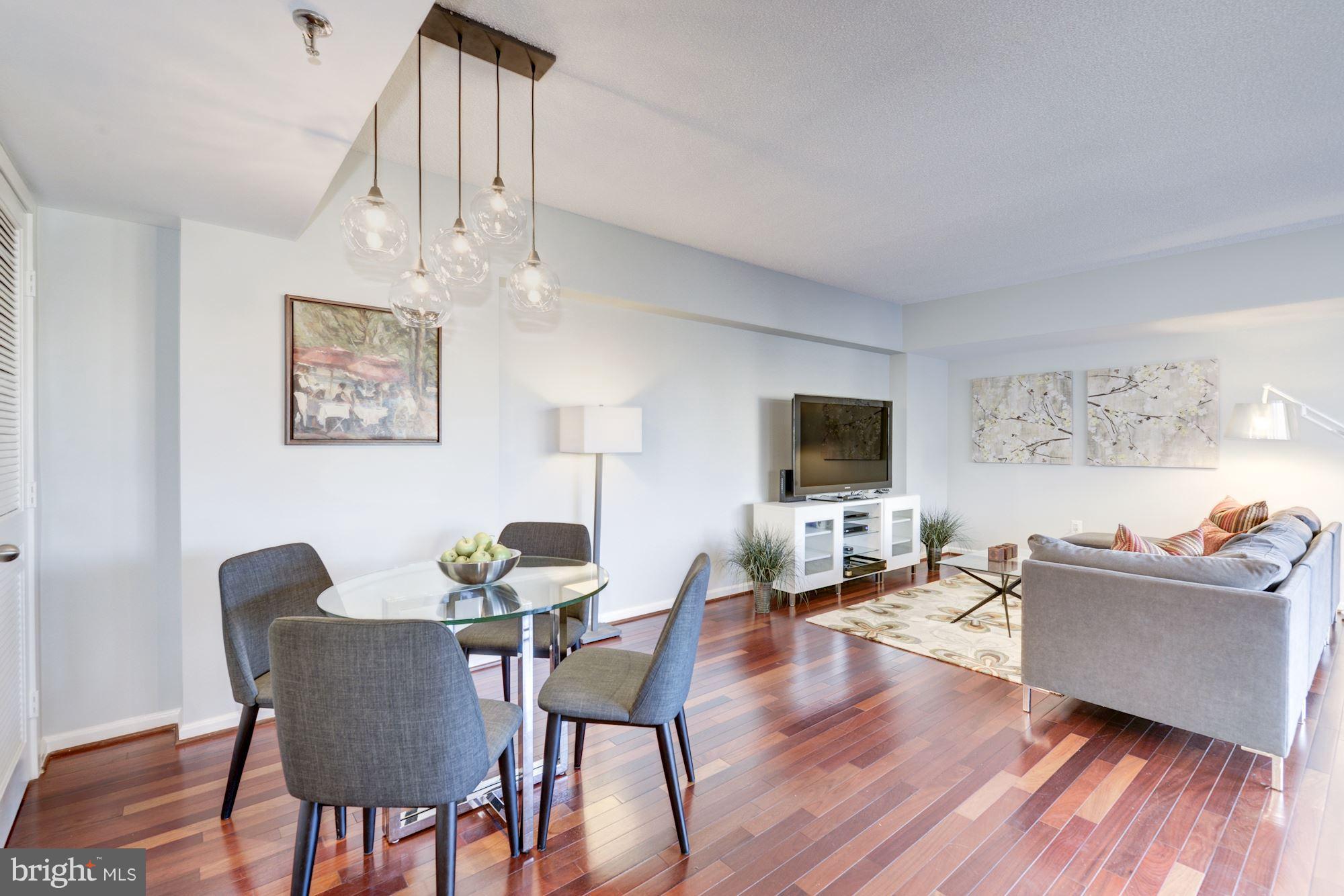2311 M Street Northwest, Unit 1002 Washington, DC 20037 - Photo 5 of 29 Large Living Room With Brazilian Cherry Floors