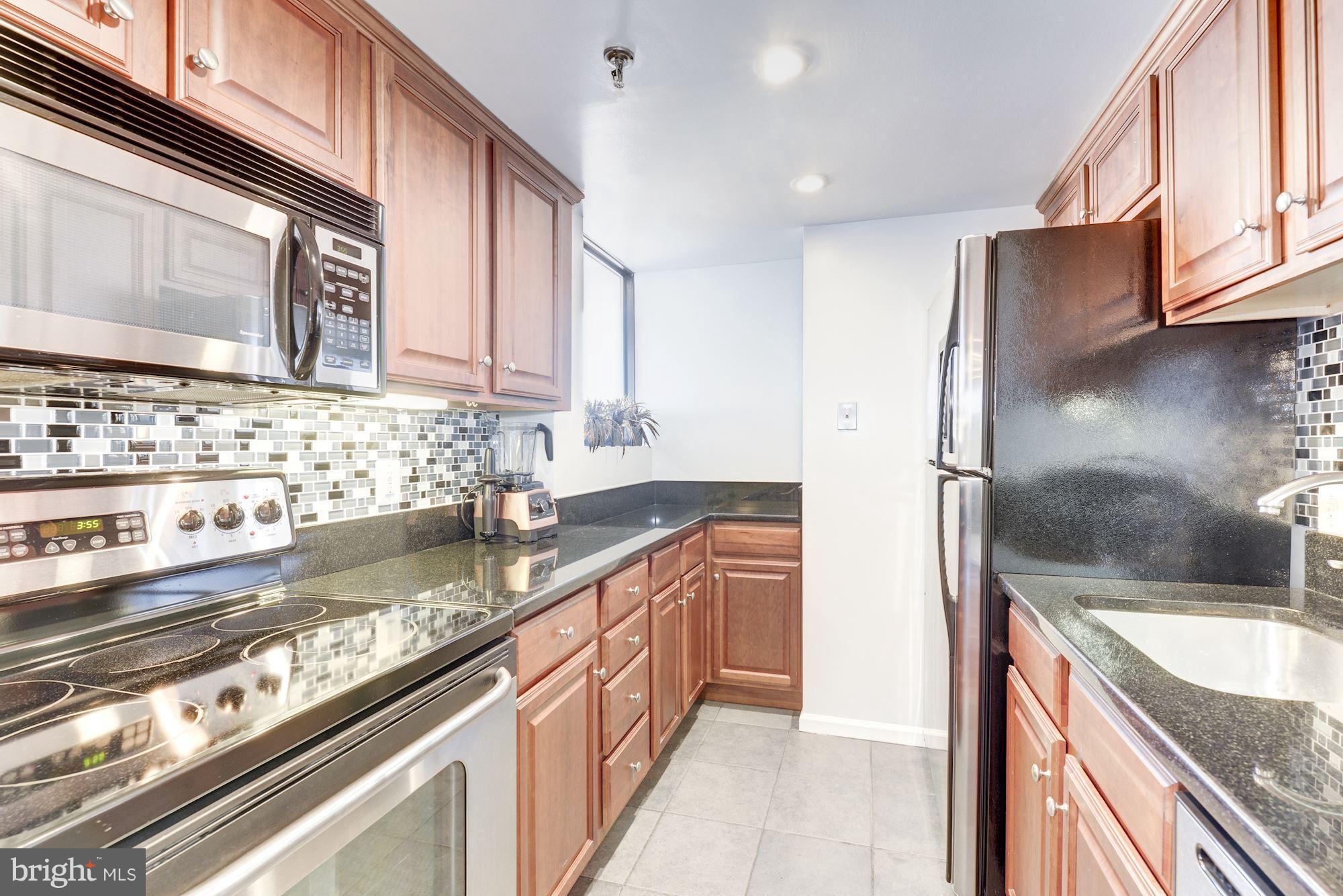 2311 M Street Northwest, Unit 1002 Washington, DC 20037 - Photo 10 of 29 Kitchen With Granite and Stainless