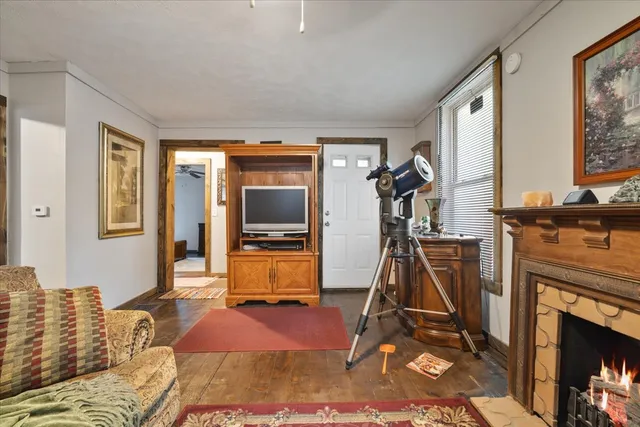 a bedroom with furniture and a flat screen tv