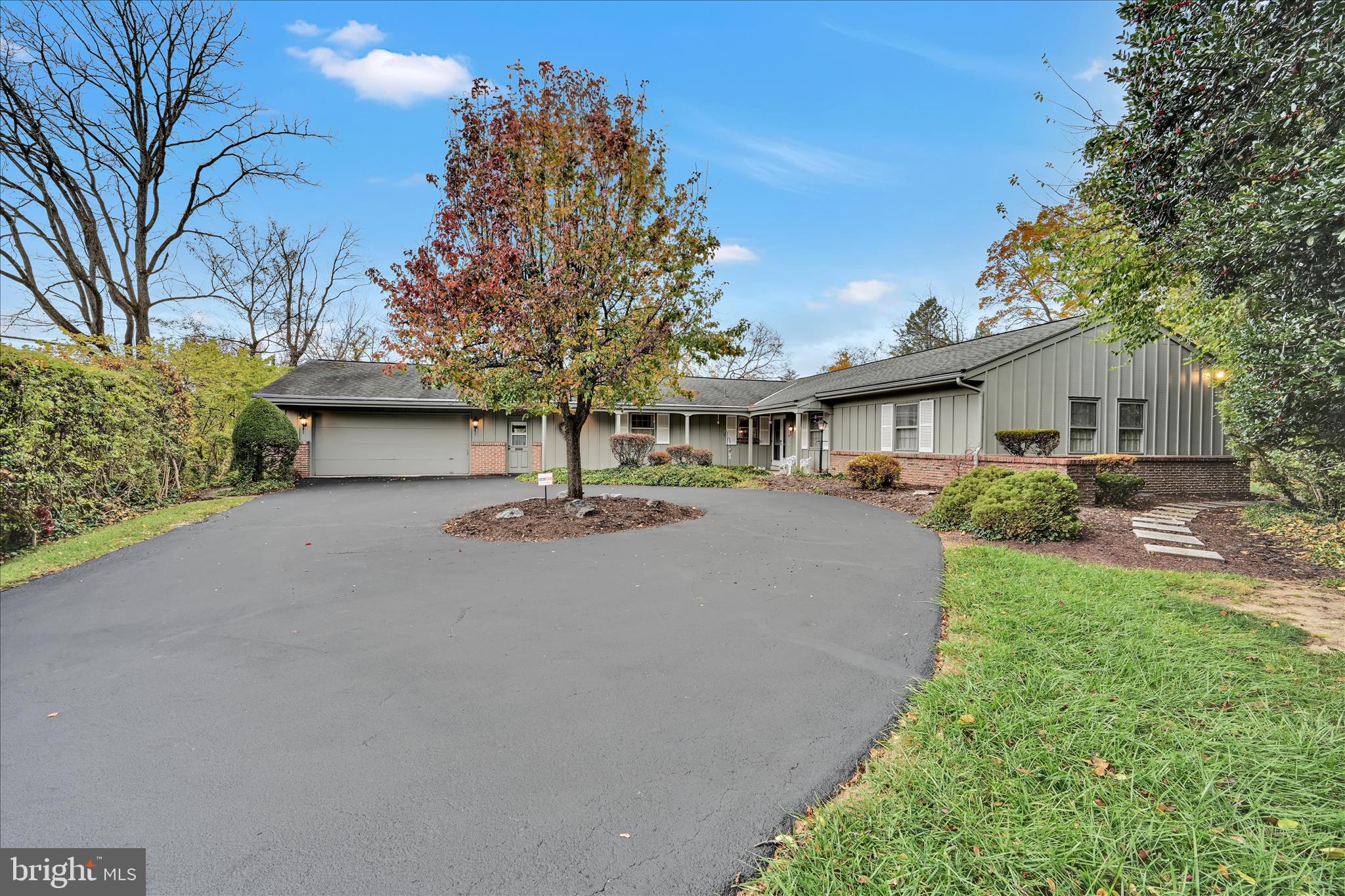 1451 Museum Road Wyomissing, PA 19610 - Photo 1 of 44 a house view with garden space and trees