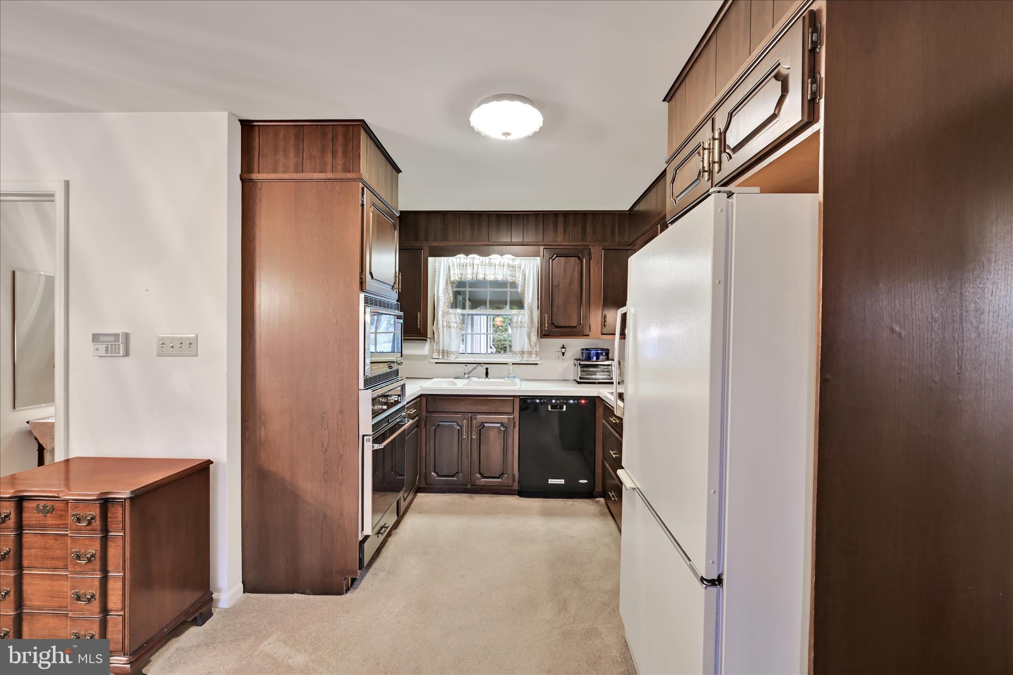 1451 Museum Road Wyomissing, PA 19610 - Photo 17 of 44 a kitchen with stainless steel appliances granite countertop a refrigerator and a sink