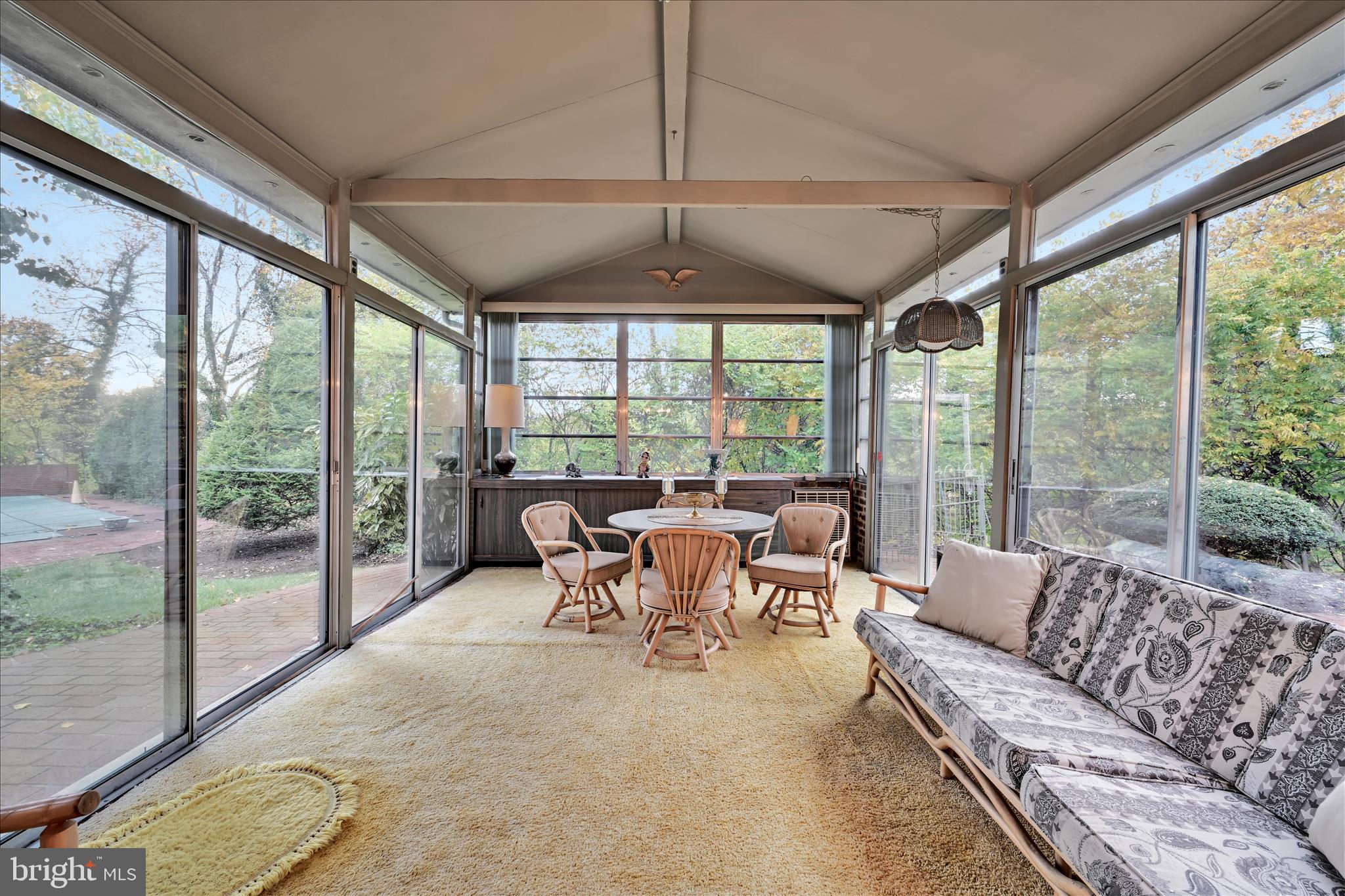 1451 Museum Road Wyomissing, PA 19610 - Photo 23 of 44 a living room with patio furniture and a floor to ceiling window