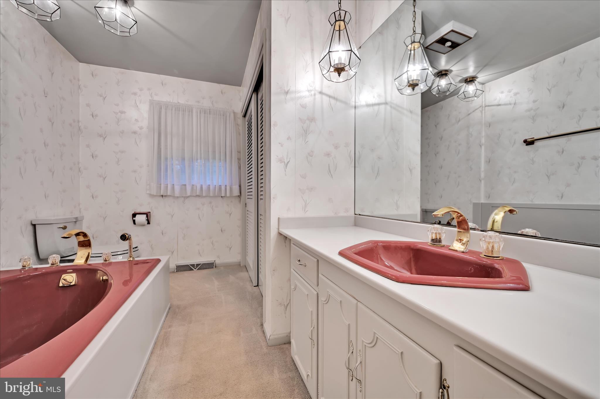 1451 Museum Road Wyomissing, PA 19610 - Photo 28 of 44 a bathroom with a tub sink and mirror