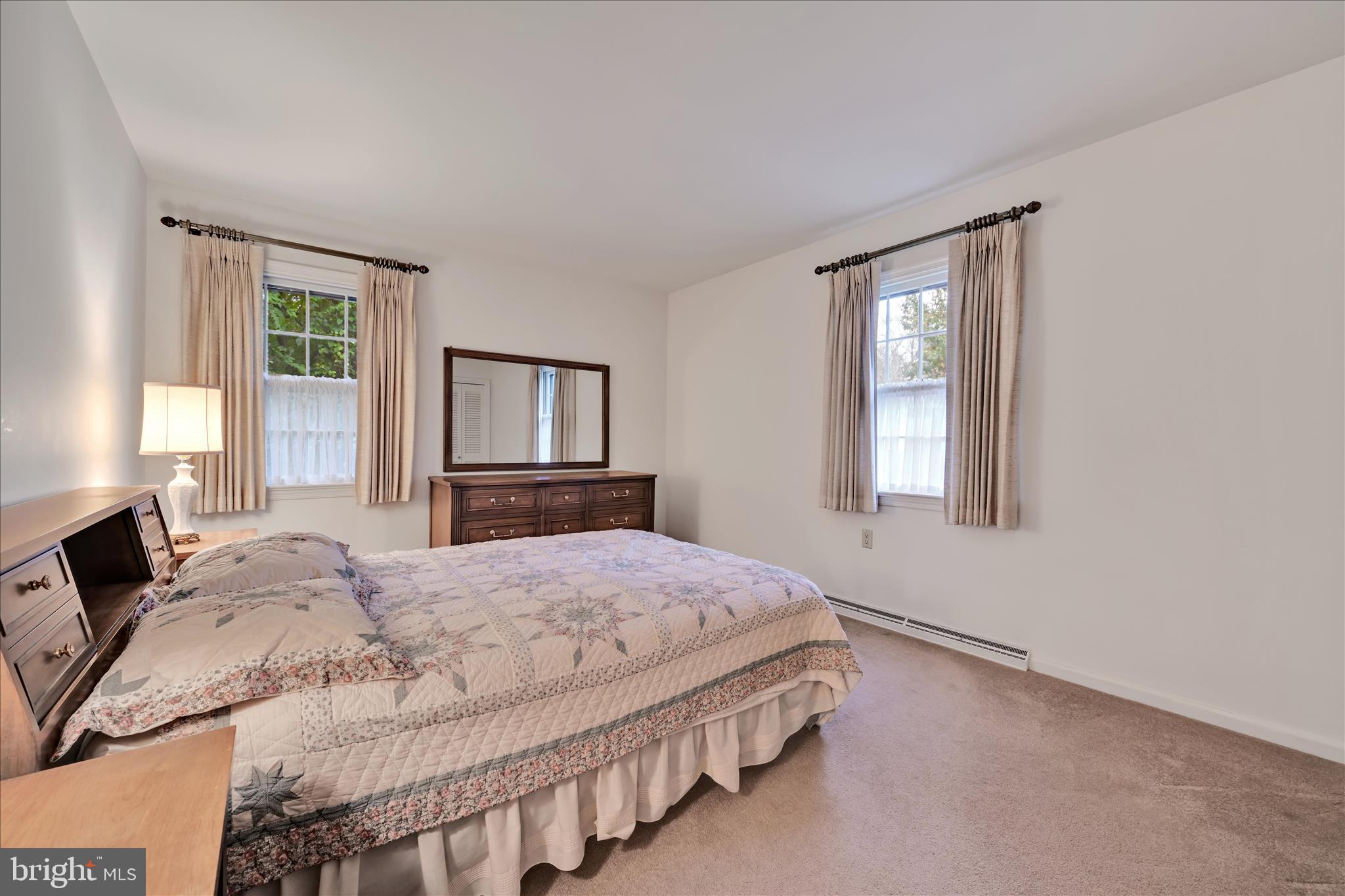 1451 Museum Road Wyomissing, PA 19610 - Photo 31 of 44 a bedroom with a bed and a window