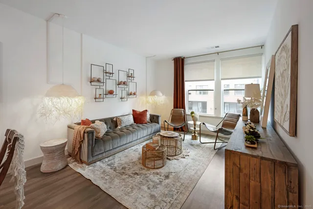 a living room with furniture and a large window