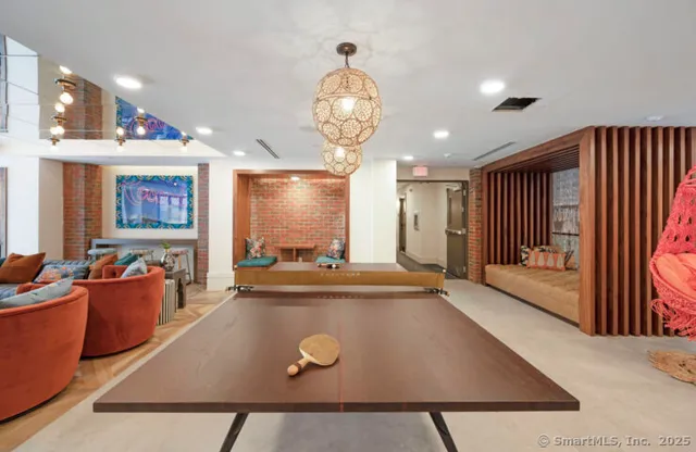 a view of a dining area with furniture and a chandelier