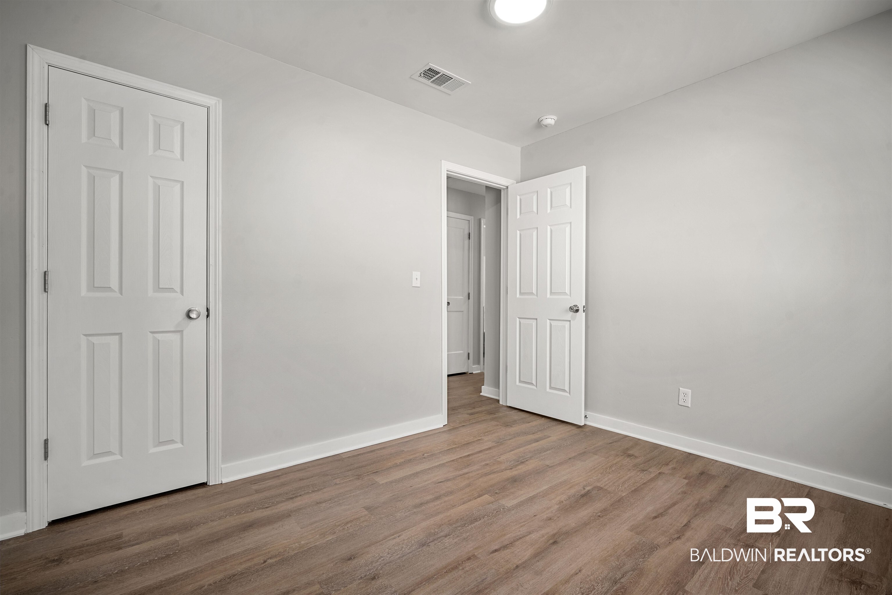 1368 Hubert Pierce Road Mobile, AL 36608 - Photo 20 of 25 Unfurnished bedroom with wood finished floors and baseboards