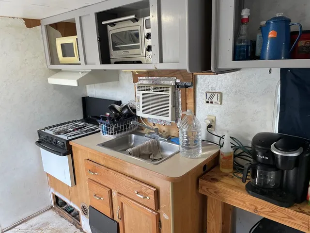 a kitchen with a stove and a sink