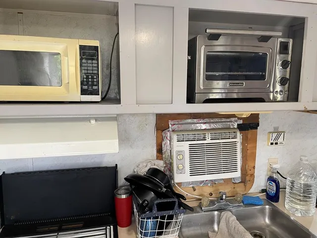 a kitchen with a stove and a microwave