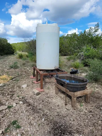 a bath tub sitting in the middle of a field