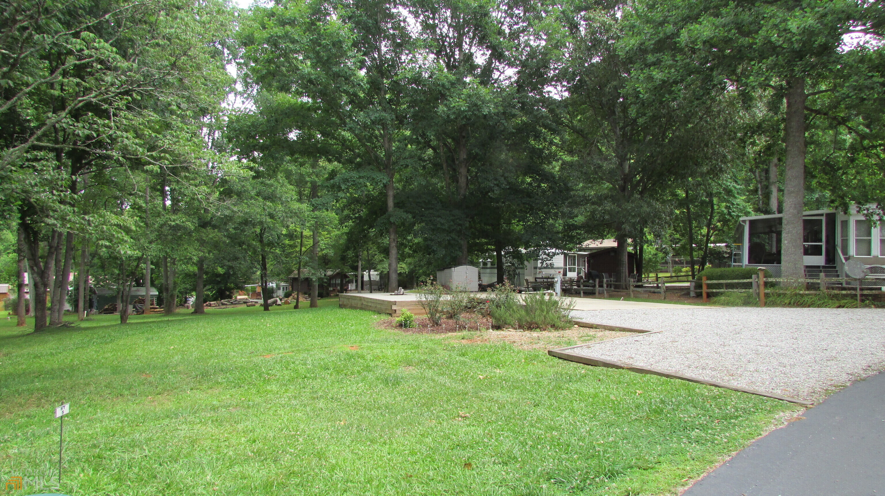 a view of backyard with green space