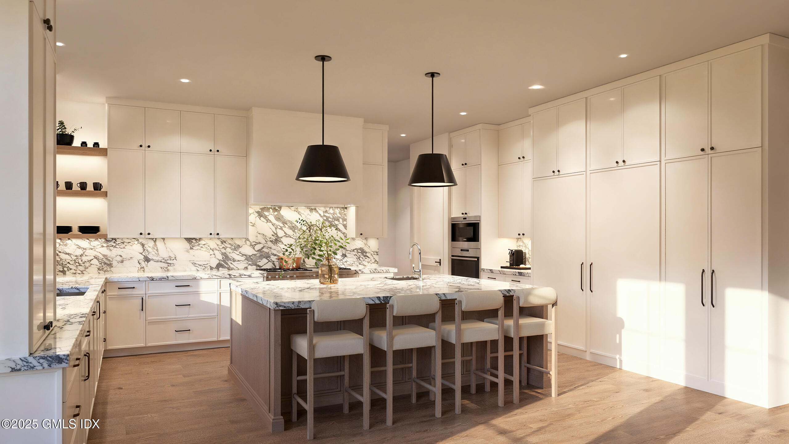 32 Pheasant Lane Greenwich, CT 06830 - Photo 5 of 10 a kitchen with stainless steel appliances kitchen island granite countertop a table chairs and a refrigerator