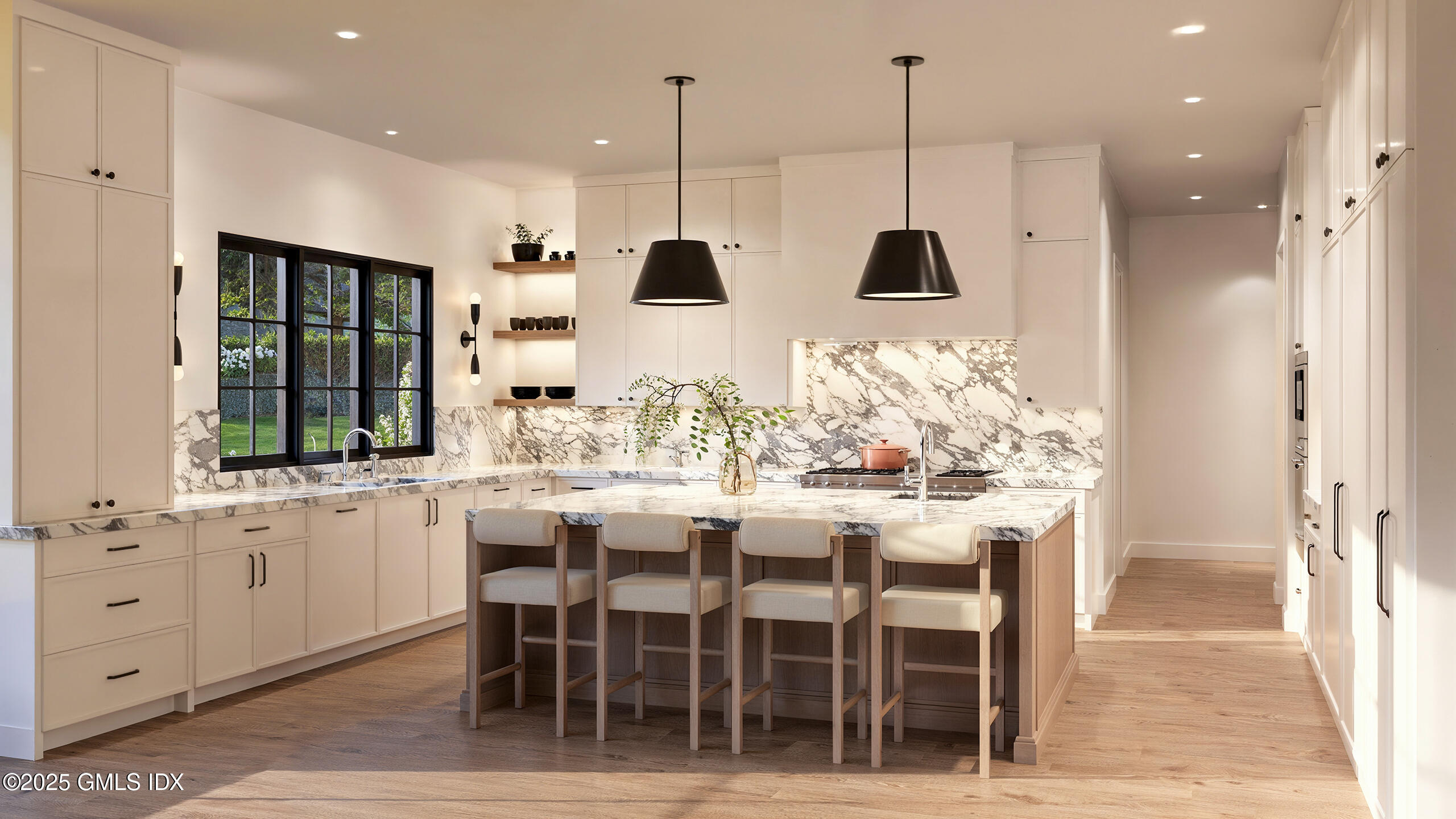 32 Pheasant Lane Greenwich, CT 06830 - Photo 6 of 10 a kitchen with stainless steel appliances kitchen island granite countertop a table and chairs in it