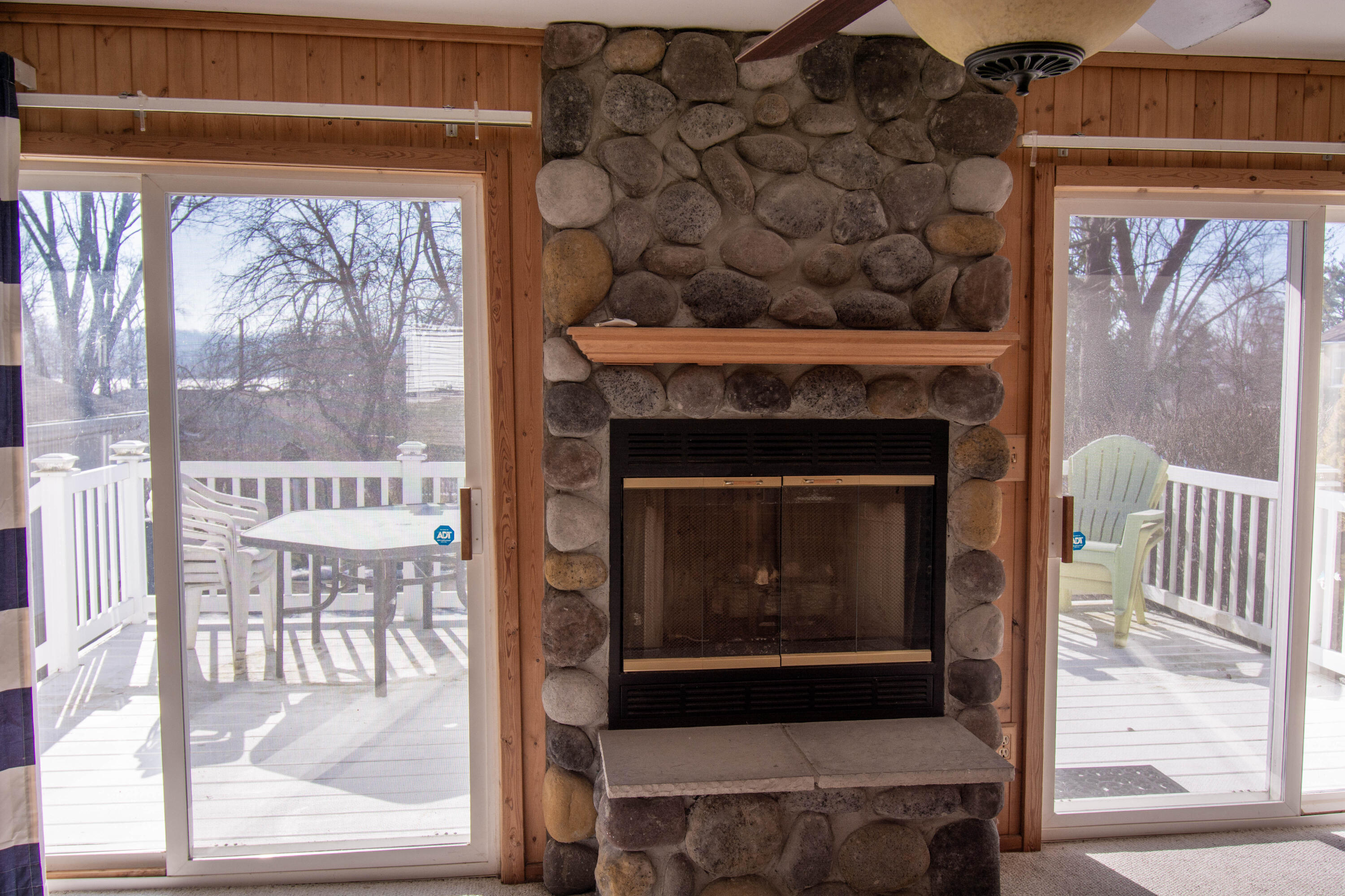 N3220 Acacia Road Geneva, WI 53147 - Photo 16 of 27 Fire Place W/Side Deck View To Lake