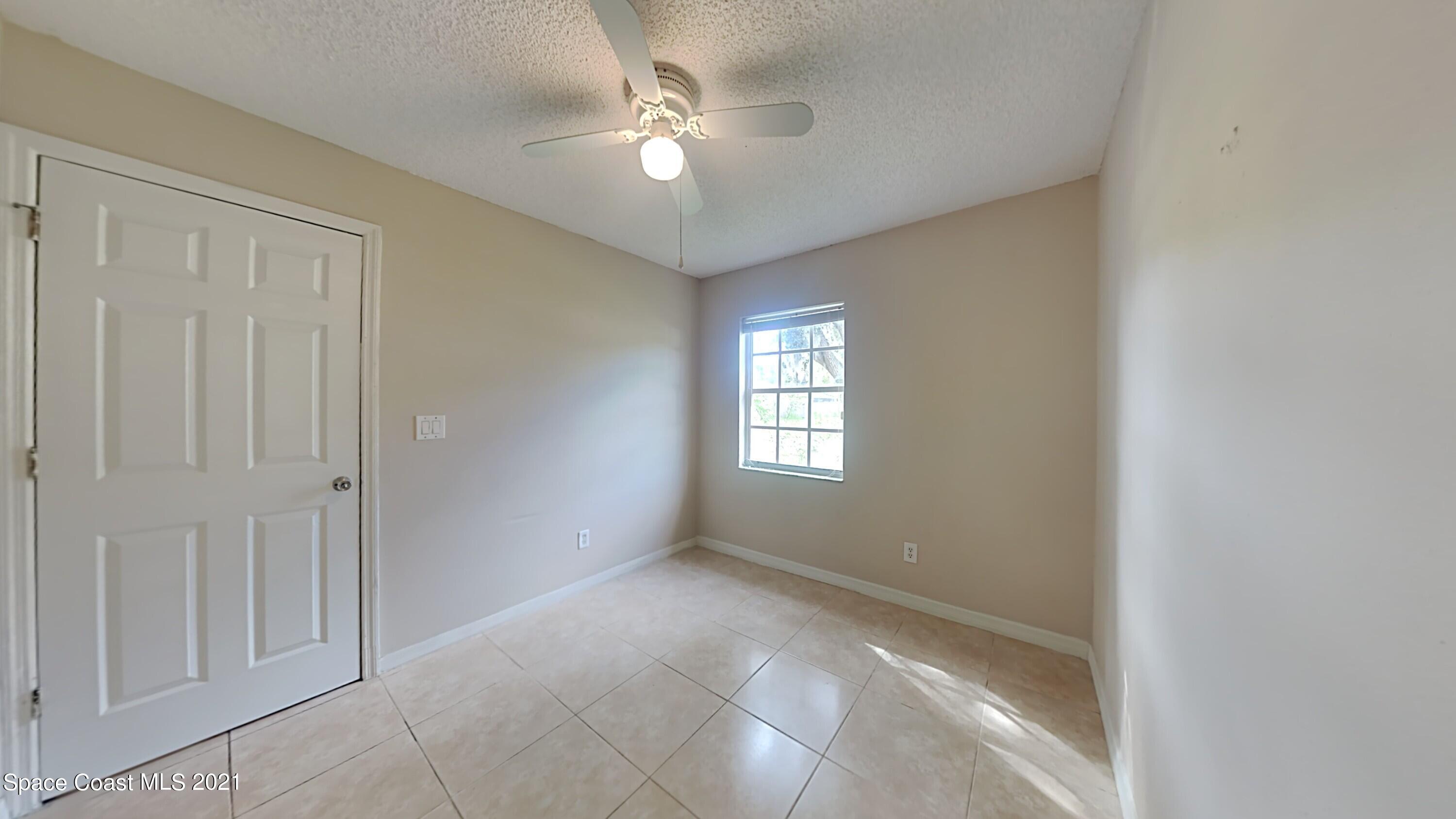 1327 Whitehurst Road Southwest Palm Bay, FL 32908 - Photo 16 of 21 a view of an empty room with a window
