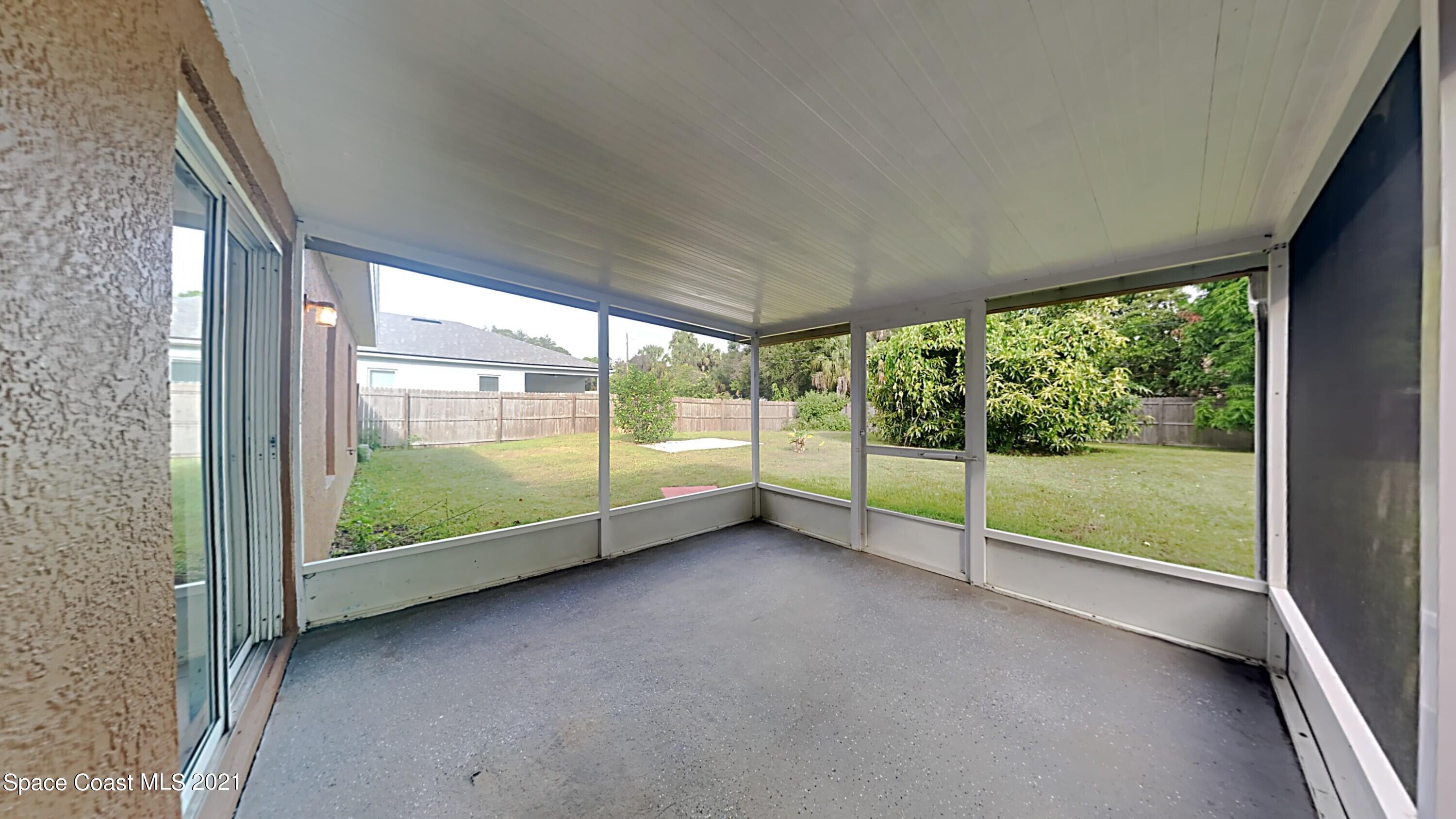 1327 Whitehurst Road Southwest Palm Bay, FL 32908 - Photo 9 of 21 a view of room with balcony and large window