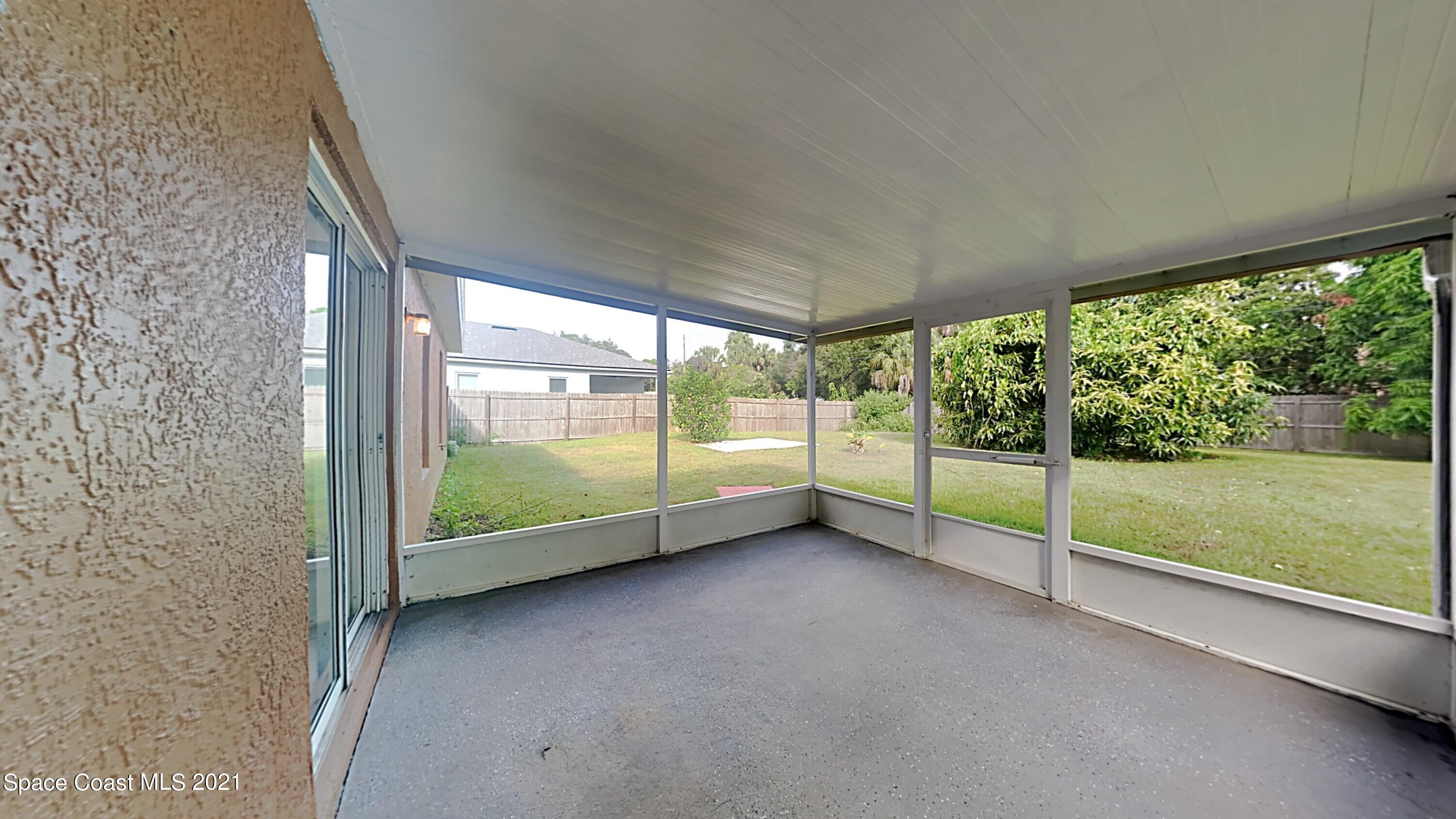 1327 Whitehurst Road Southwest Palm Bay, FL 32908 - Photo 10 of 21 a view of a big room with large windows and city view