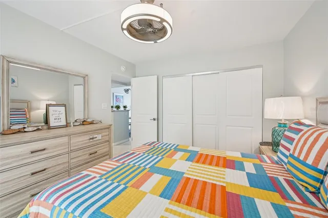 a bedroom with a bed and a dresser