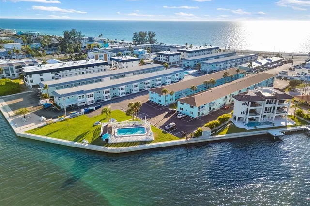 a view of a swimming pool with lawn chairs