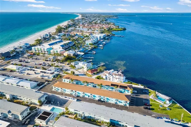 an aerial view of a house with a ocean view
