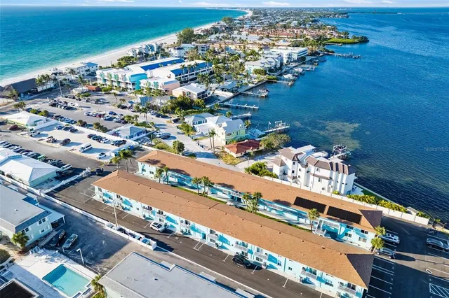 an aerial view of a house with a swimming pool yard and outdoor seating