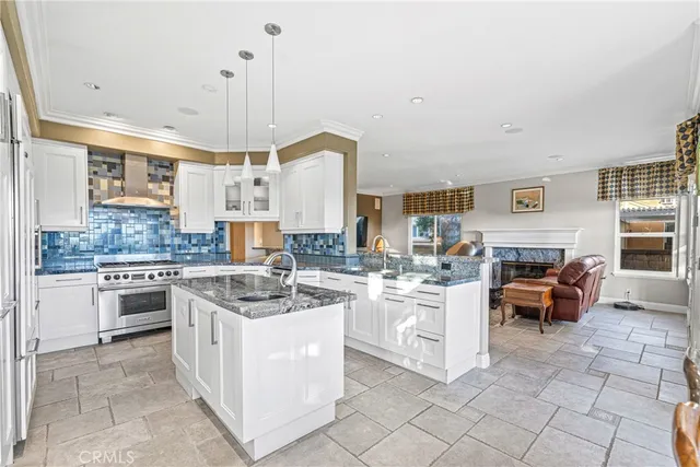 a kitchen with cabinets and chairs