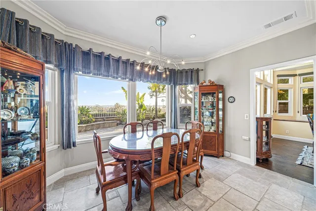 a view of a dining room with furniture window and outside view