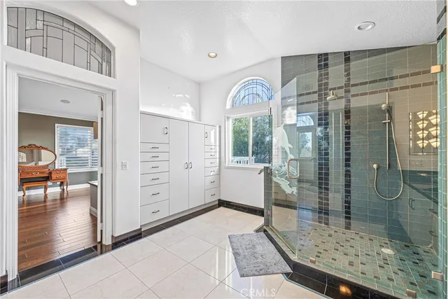 a view of entryway with a large window and chandelier