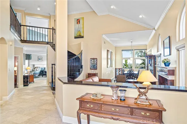 a living room with fireplace furniture and a rug