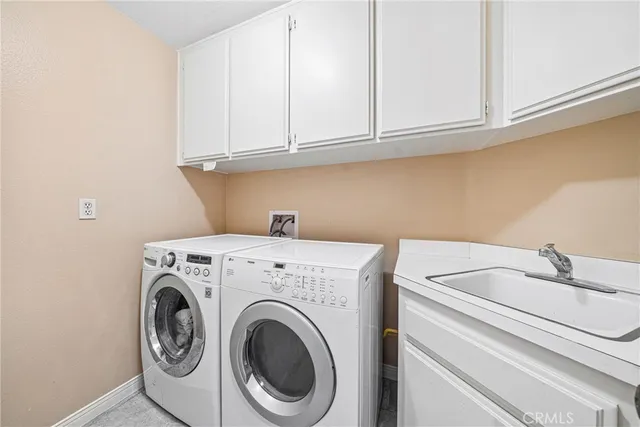 a view of a patio with a table chairs and backyard