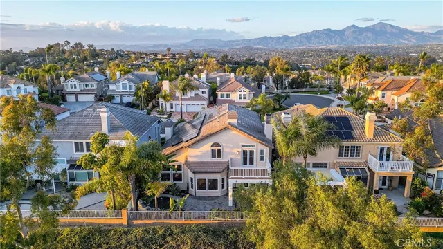 an aerial view of residential building and trees around