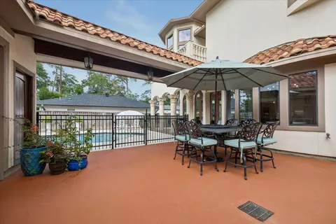 a view of a backyard with sitting area