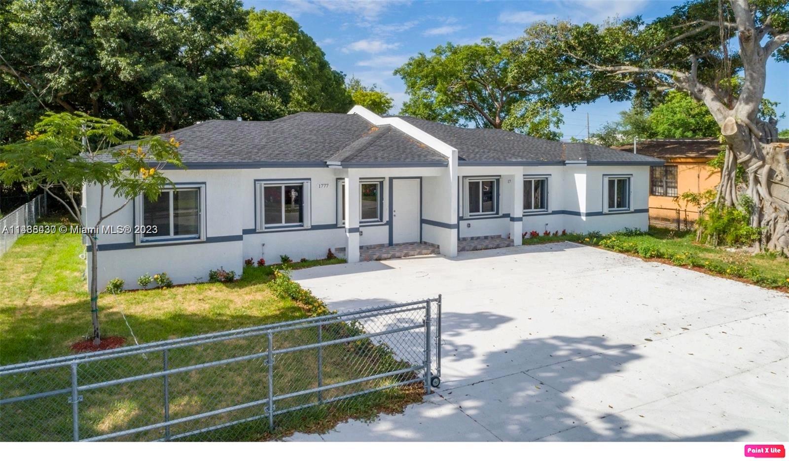 Gladeview Miami, FL 33147 - Photo 1 of 8 a front view of a house with garden