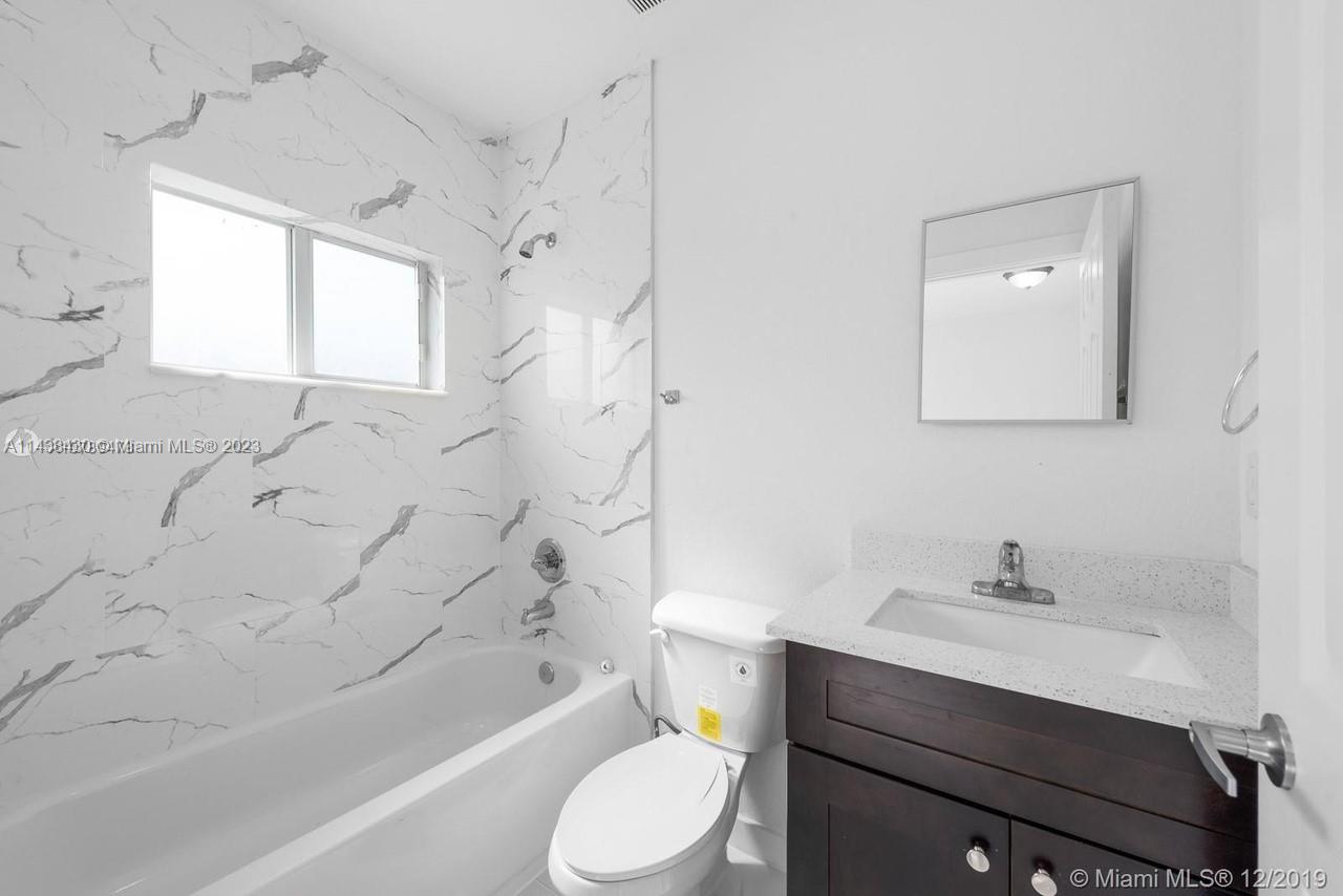 Gladeview Miami, FL 33147 - Photo 7 of 8 a bathroom with a sink toilet and shower