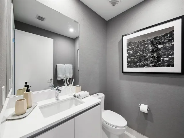 a large bathroom with a large tub and sink