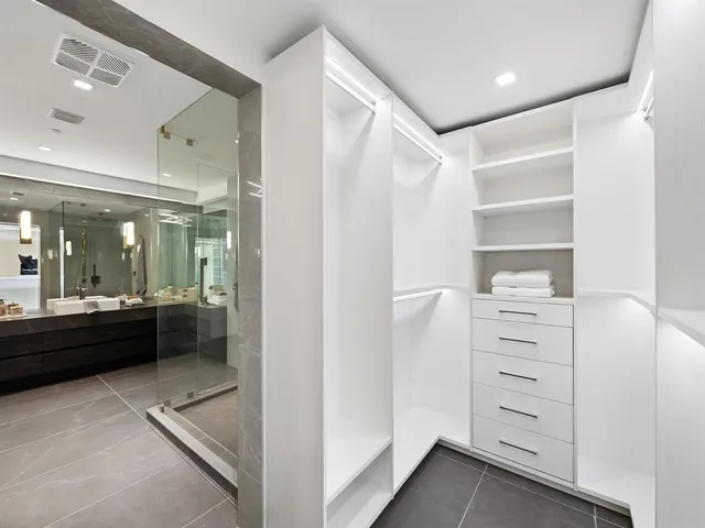 a utility room with sink dryer and washer