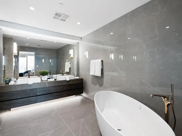 a living room with lots of furniture and white umbrellas