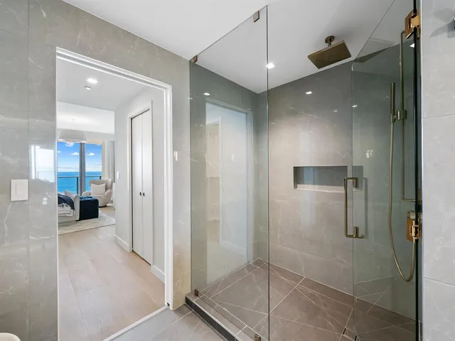 a living room with lots of furniture and white walls