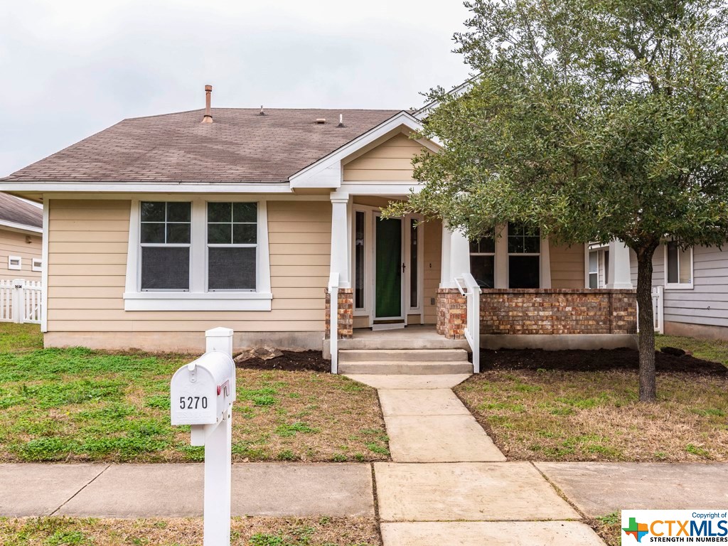 a front view of a house with a garage
