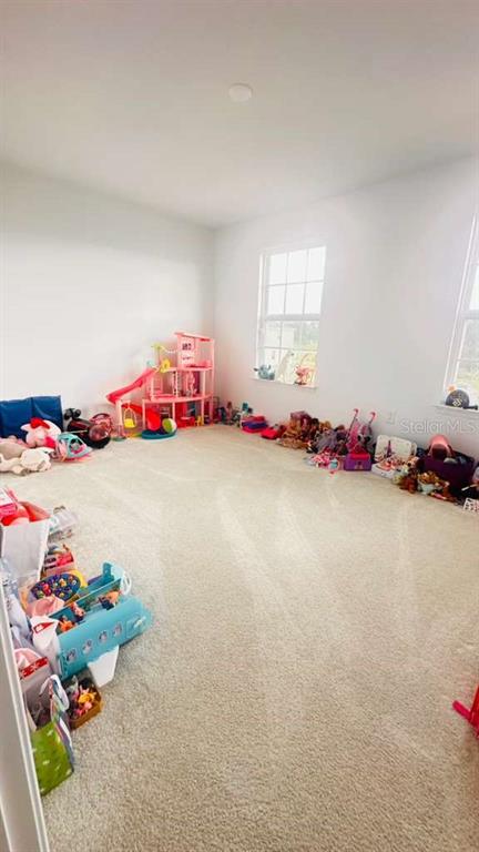 3166 Armstrong Spring Drive Kissimmee, FL 34744 - Photo 22 of 30 a view of room with toys and wooden floor