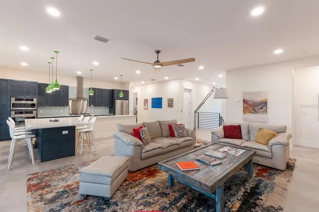 a bedroom with furniture and a flat screen tv