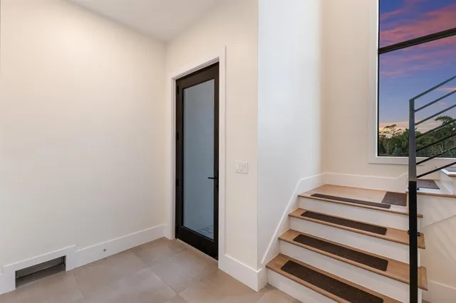 a kitchen with granite countertop stainless steel appliances and wooden cabinets