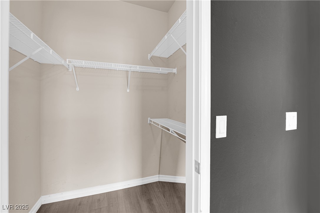 10550 West Alexander Road, Unit 2079 Las Vegas, NV 89129 - Photo 20 of 40 Spacious closet featuring wood finished floors