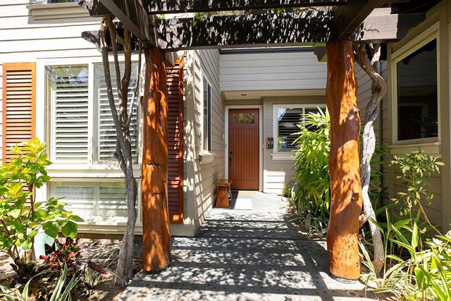 a view of a house with a potted plant